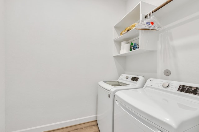 19015 Giara Pony Trl, Tomball, TX 77377 - laundry area with independent washer and dryer and light wood finished floors