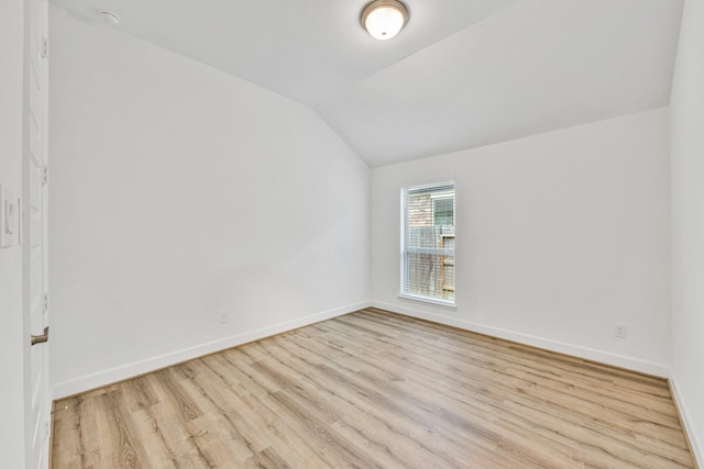 19015 Giara Pony Trl, Tomball, TX 77377 - spare room with wood finished floors and lofted ceiling