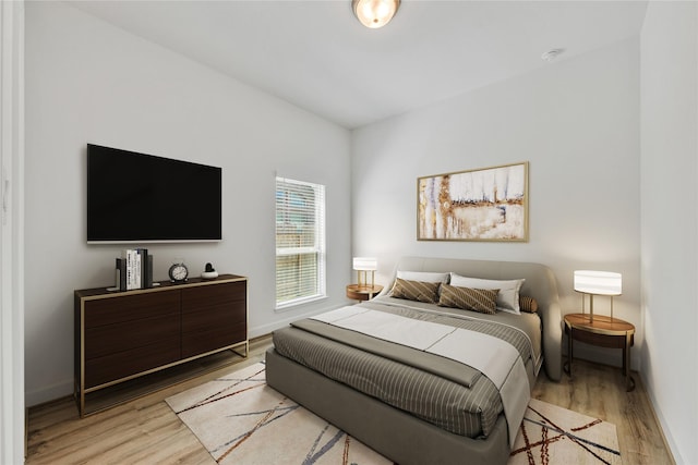 19015 Giara Pony Trl, Tomball, TX 77377 - bedroom with light wood-style floors and baseboards