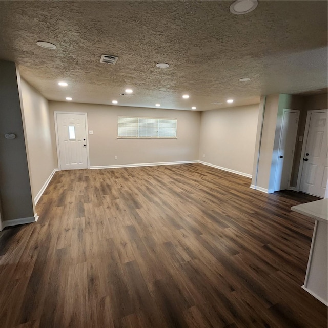 3625 Whatley Dr, Deer Park, TX 77536 - entrance foyer with a textured ceiling, baseboards, recessed lighting, and dark wood-style floors