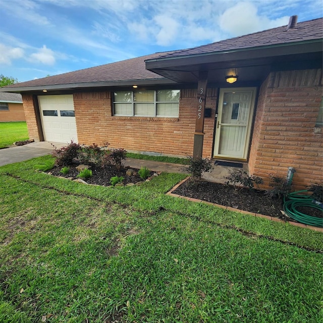 3625 Whatley Dr, Deer Park, TX 77536 - doorway to property featuring brick siding, driveway, a yard, and a garage