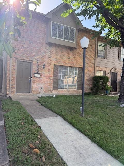 7358 Crownwest St Unit 7358, Houston, TX 77072 - view of front of property with a front yard and brick siding