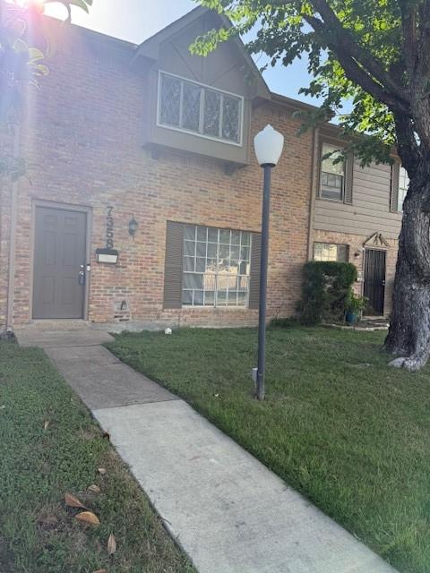 7358 Crownwest St Unit 7358, Houston, TX 77072 - view of front of house with brick siding and a front yard