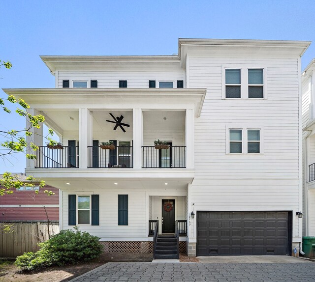 1226 W 17th St Unit D, Houston, TX 77008 - view of front of house featuring a balcony, an attached garage, fence, and decorative driveway