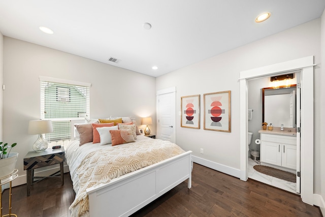 1226 W 17th St Unit D, Houston, TX 77008 - bedroom featuring dark wood-type flooring, recessed lighting, connected bathroom, baseboards, and a closet