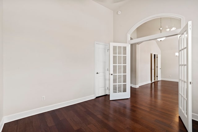 20506 Nellie Gail Trail Ln, Katy, TX 77450 - empty room featuring french doors, wood finished floors, and baseboards