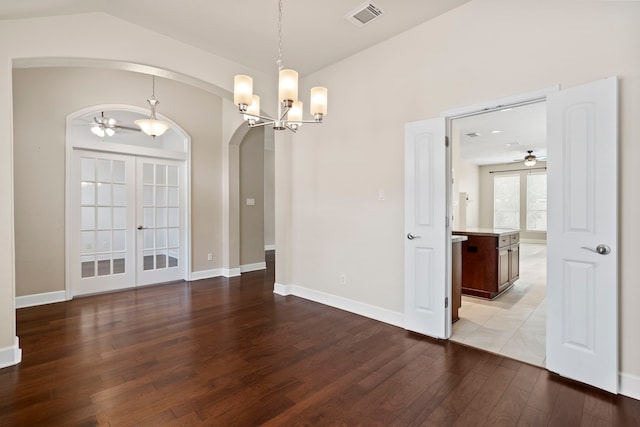20506 Nellie Gail Trail Ln, Katy, TX 77450 - empty room with arched walkways, wood finished floors, ceiling fan, a chandelier, and baseboards