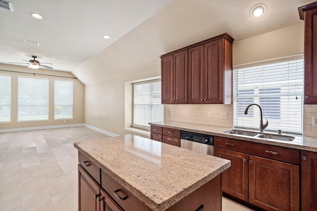 20506 Nellie Gail Trail Ln, Katy, TX 77450 - kitchen featuring dishwasher, a sink, lofted ceiling, ceiling fan, and backsplash