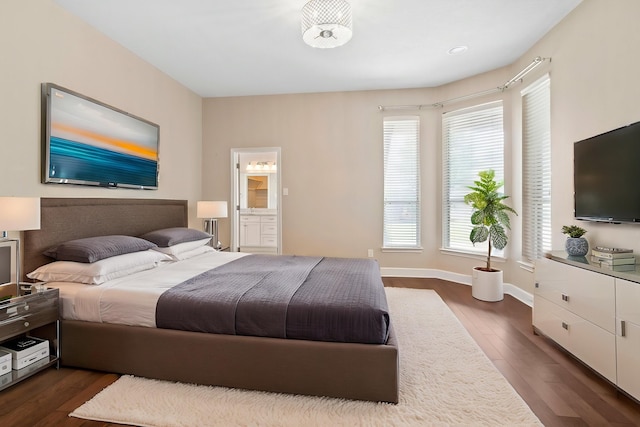 20506 Nellie Gail Trail Ln, Katy, TX 77450 - bedroom featuring dark wood-type flooring, baseboards, and ensuite bathroom