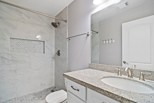 20506 Nellie Gail Trail Ln, Katy, TX 77450 - bathroom featuring toilet, vanity, and a tile shower