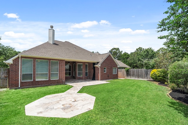 20506 Nellie Gail Trail Ln, Katy, TX 77450 - back of property featuring a patio, a chimney, brick siding, and a shingled roof