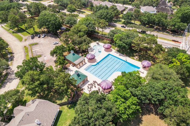 20506 Nellie Gail Trail Ln, Katy, TX 77450 - drone / aerial view of a pool and a tree filled landscape