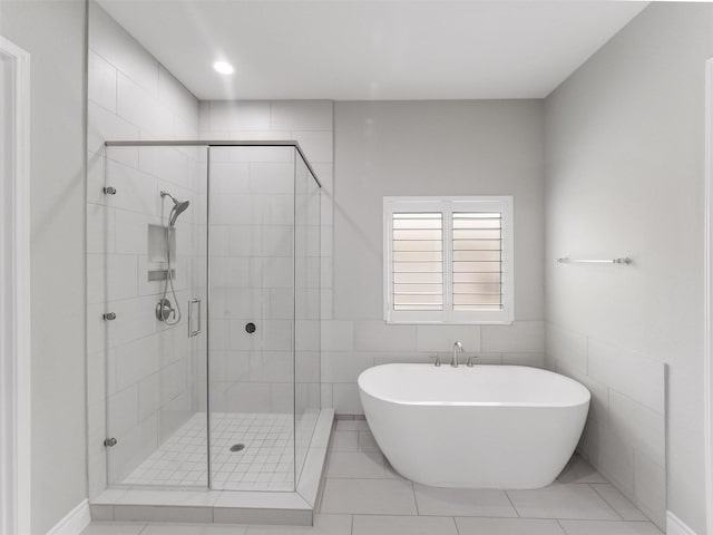 15806 Gibson Grass Ct, Spring, TX 77379 - full bathroom with a freestanding bath, a shower stall, and tile patterned floors