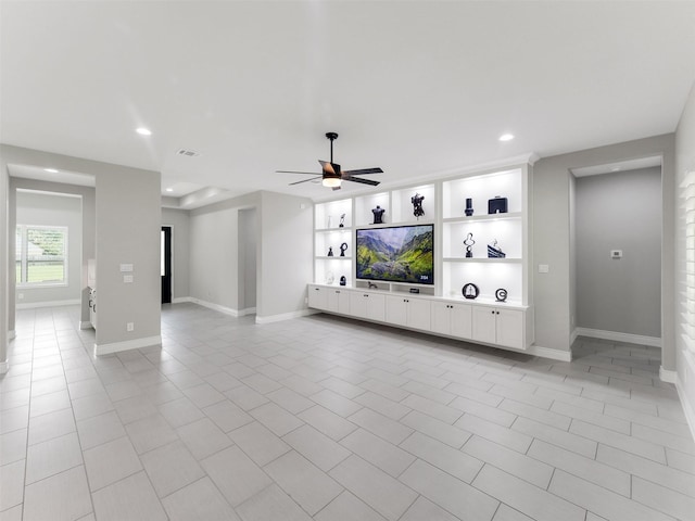 15806 Gibson Grass Ct, Spring, TX 77379 - unfurnished living room with recessed lighting, baseboards, ceiling fan, light tile patterned flooring, and built in shelves