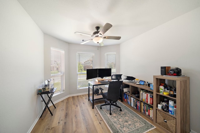 11311 Cascading Stream Way, Houston, TX 77044 - home office with light wood-style floors, ceiling fan, and baseboards