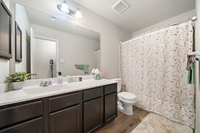 11311 Cascading Stream Way, Houston, TX 77044 - full bath featuring wood finished floors, toilet, and vanity