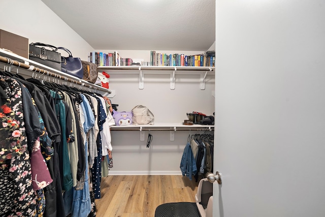 11311 Cascading Stream Way, Houston, TX 77044 - walk in closet with wood finished floors