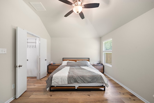 11311 Cascading Stream Way, Houston, TX 77044 - bedroom with vaulted ceiling, wood finished floors, and a ceiling fan