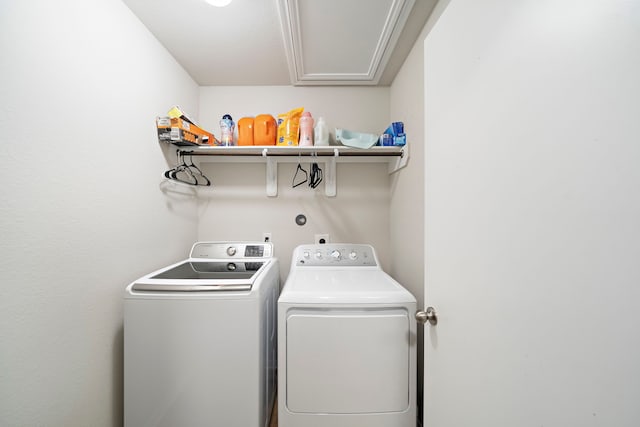 11311 Cascading Stream Way, Houston, TX 77044 - clothes washing area featuring washing machine and dryer