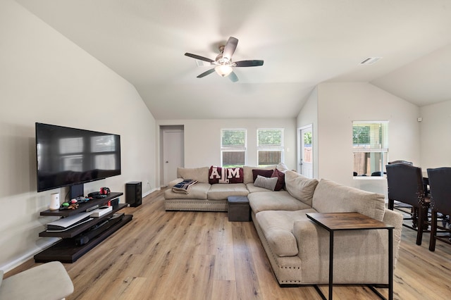 11311 Cascading Stream Way, Houston, TX 77044 - living room with vaulted ceiling, ceiling fan, and light wood finished floors