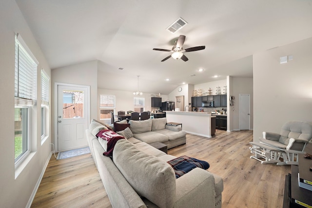 11311 Cascading Stream Way, Houston, TX 77044 - living room featuring light wood finished floors, ceiling fan, vaulted ceiling, baseboards, and recessed lighting