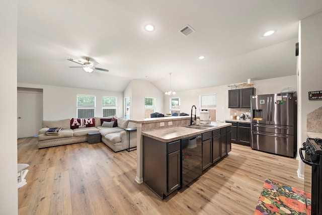 11311 Cascading Stream Way, Houston, TX 77044 - kitchen with black appliances, a sink, light wood-style flooring, vaulted ceiling, and a ceiling fan