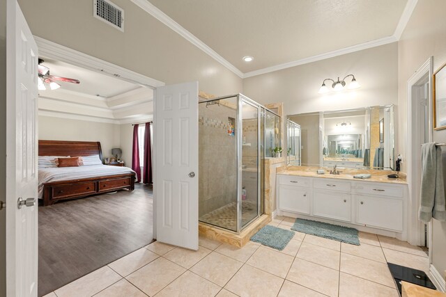 19509 Desna Dr, Porter, TX 77365 - bathroom featuring connected bathroom, vanity, crown molding, a stall shower, and tile patterned floors