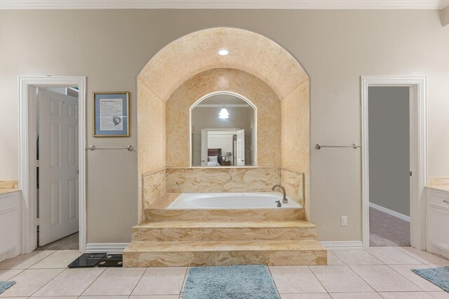 19509 Desna Dr, Porter, TX 77365 - bathroom featuring a garden tub, vanity, tile patterned flooring, and crown molding