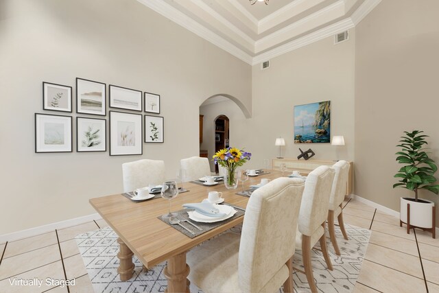 19509 Desna Dr, Porter, TX 77365 - dining space with arched walkways, light tile patterned floors, a towering ceiling, baseboards, and ornamental molding