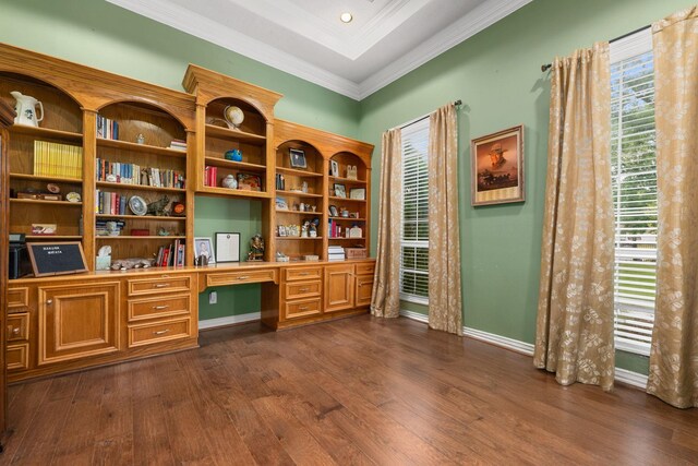 19509 Desna Dr, Porter, TX 77365 - office featuring built in desk, dark wood-style flooring, ornamental molding, and baseboards