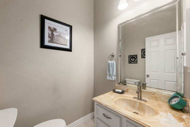 19509 Desna Dr, Porter, TX 77365 - half bathroom featuring toilet, vanity, and baseboards