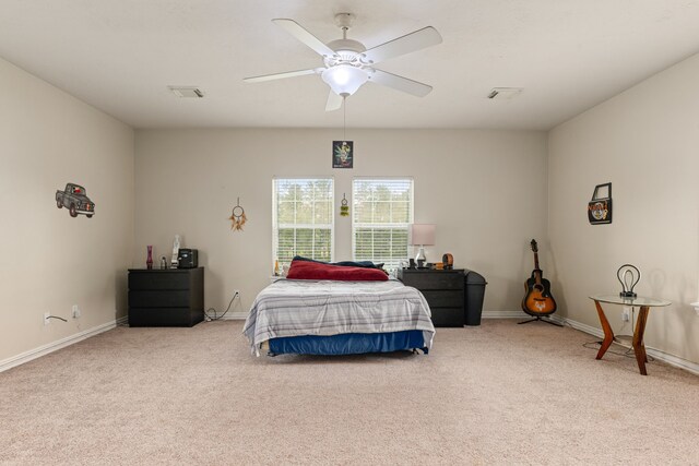 19509 Desna Dr, Porter, TX 77365 - bedroom with carpet flooring, baseboards, and a ceiling fan