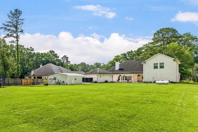 19509 Desna Dr, Porter, TX 77365 - rear view of property with a chimney and view of scattered trees