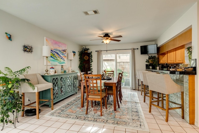 29 Quintana Dr, Galveston, TX 77554 - dining area with a ceiling fan and light tile patterned floors