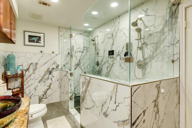 29 Quintana Dr, Galveston, TX 77554 - bathroom featuring tile walls, toilet, a marble finish shower, vanity, and recessed lighting