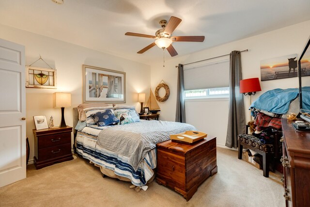 29 Quintana Dr, Galveston, TX 77554 - bedroom with light carpet and ceiling fan