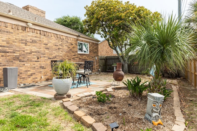 29 Quintana Dr, Galveston, TX 77554 - fenced backyard with a patio