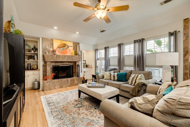 29 Quintana Dr, Galveston, TX 77554 - living area featuring light wood-style floors, ceiling fan, a fireplace, and recessed lighting