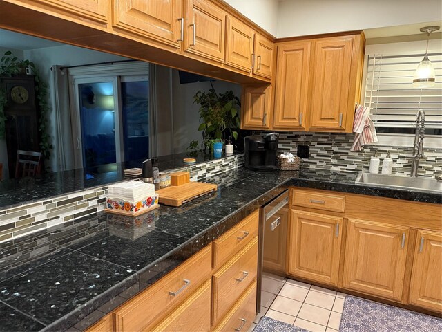 29 Quintana Dr, Galveston, TX 77554 - kitchen featuring decorative backsplash, dishwasher, a sink, and light tile patterned floors