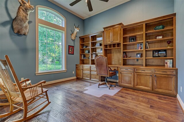 19926 Gemstone Dr, Montgomery, TX 77356 - office area with ceiling fan, wood finished floors, baseboards, ornamental molding, and built in study area