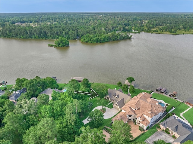 19926 Gemstone Dr, Montgomery, TX 77356 - drone / aerial view of a heavily wooded area and a large body of water