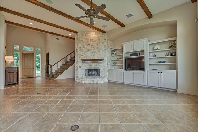 19926 Gemstone Dr, Montgomery, TX 77356 - unfurnished living room featuring beamed ceiling, ceiling fan, light tile patterned floors, a stone fireplace, and recessed lighting