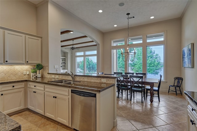 19926 Gemstone Dr, Montgomery, TX 77356 - kitchen with a sink, dishwasher, tasteful backsplash, crown molding, and arched walkways