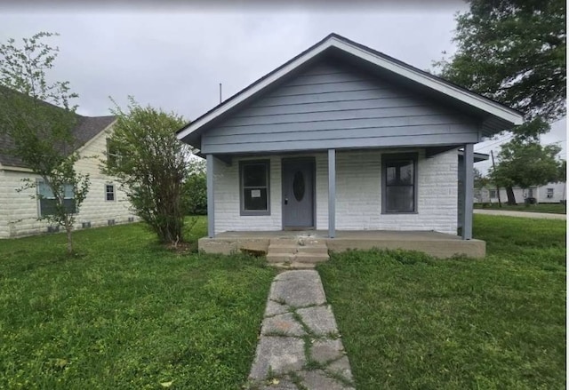 1300 Burbank St, Baytown, TX 77520 - bungalow-style house featuring a porch and a front yard