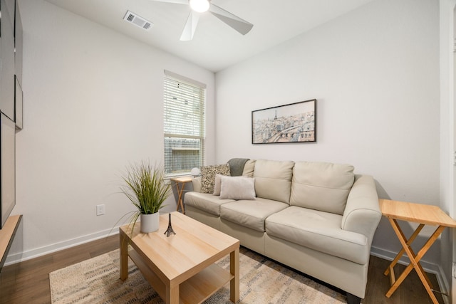 living room with ceiling fan, wood finished floors, and baseboards