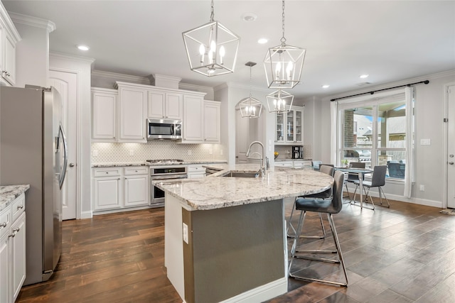 2023 Aspen Point Ln, Richmond, TX 77469 - kitchen featuring stainless steel appliances, a sink, recessed lighting, white cabinets, and a center island with sink