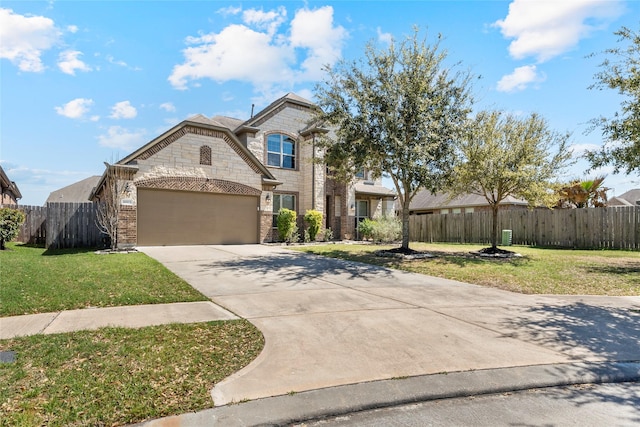 2023 Aspen Point Ln, Richmond, TX 77469 - french provincial home featuring driveway, an attached garage, and stone siding