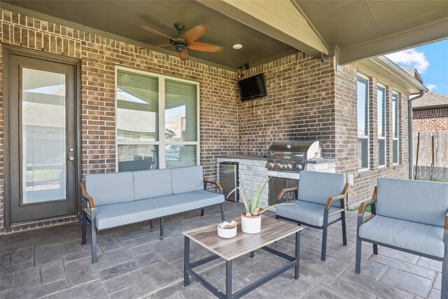 2023 Aspen Point Ln, Richmond, TX 77469 - view of patio with an outdoor hangout area, an outdoor kitchen, a ceiling fan, grilling area, and fence