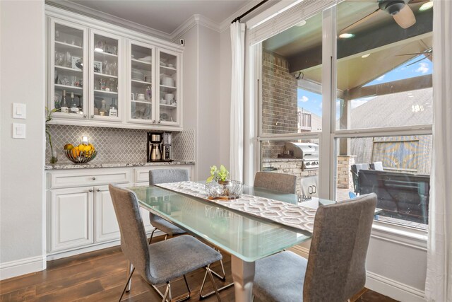 2023 Aspen Point Ln, Richmond, TX 77469 - dining area with dark wood-type flooring, baseboards, and ornamental molding
