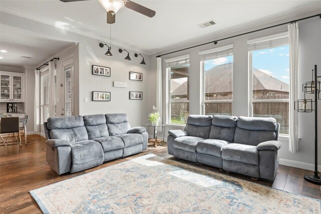 2023 Aspen Point Ln, Richmond, TX 77469 - living room with healthy amount of natural light, ornamental molding, a ceiling fan, and wood finished floors